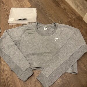 Gymshark long sleeve cotton cropped shirt, size large. New in bag. Super cute!